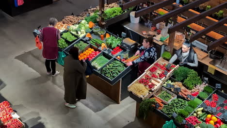 Agenskalns-market,-Riga,-Latvia:-Low-angle-shot-over-a-stylishly-restored-old-building-selling-fruits-and-vegetables