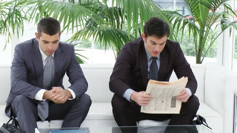 Businessmen-sitting-on-sofa-