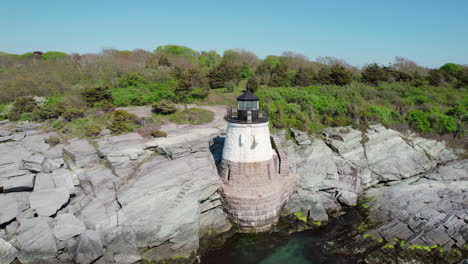 Circular-flight-of-Castle-Hill-Lighthouse-on-the-shores-of-Narragansett-Bay,-Newport,-RI