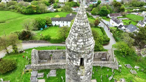 Ireland-Epic-locations-drone-closeup-of-Ardmore-Round-Tower-and-cathedral-static-shot-in-Waterford-on-a-summer-day