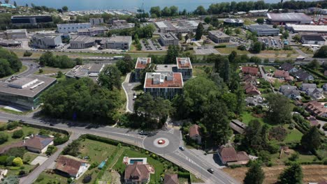 High-angle-aerial-of-a-beautiful-apartment-complex-in-a-small-town-near-Lake-Geneva-in-Switzerland