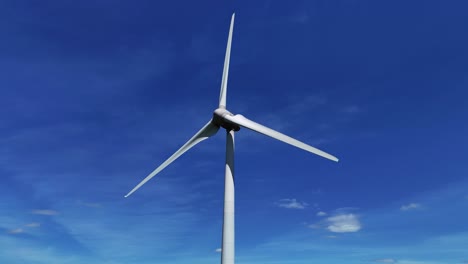 A-wind-turbine-spins-against-a-clear-blue-sky