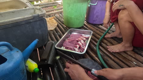 Slicing-through-raw-beef-with-precision,-each-stroke-revealing-marbled-layers-of-crimson-flesh