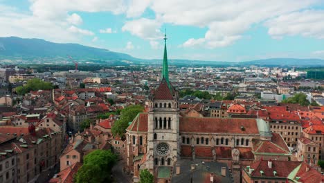 Beautiful-aerial-orbit-of-the-Geneva-Cathedral,-Cathédrale-Saint-Pierre-Genève,-on-a-beautiful-sunny-summer-day-in-Switzerland