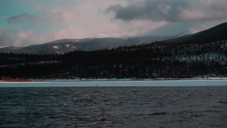 Snowy-landscape-of-Twin-Lakes,-Colorado,-featuring-majestic-mountains-and-a-cloudy-sky,-perfect-for-relaxation-and-meditation