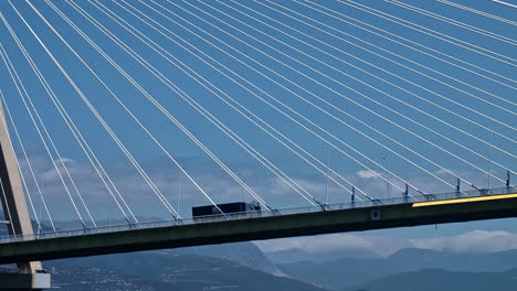 Rio-Antirio-bridge-in-Patra-in-Greece-with-semi-truck-driving-over,-slow-motion