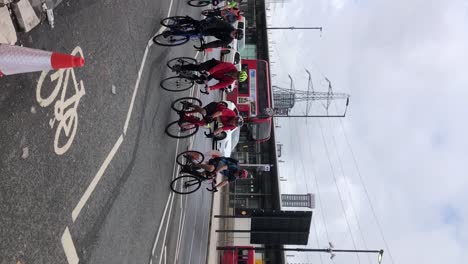 Vertical-video-of-Cyclists-peddle-through-Canning-Town-as-part-of-the-Ride-London-Tour