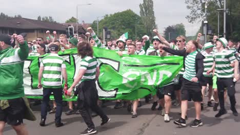 Celtic-fans-heading-to-Hampden-Park-with-a-large-green-and-white-banner