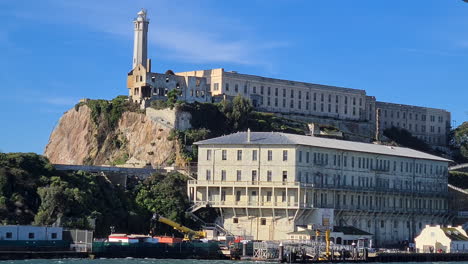 Alcatraz-Island-and-Former-Prison-Buildings,-View-From-Ferry-on-Sunny-Day,-California-USA