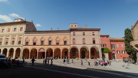 Sunny-day-in-Bologna,-vibrant-city-life-at-an-historic-Italian-square