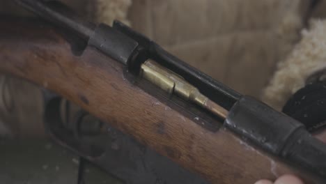 Loading-bullet-in-vintage-riffle-in-battle-World-War-One