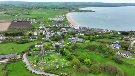 Ireland-Epic-locations-drone-panorama-of-Ardmore-Round-Tower-and-cathedral-looking-to-Ardmore-Village-and-Beach-in-Waterford