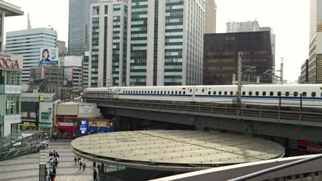 Fast-and-dynamic-Tokaido-Shinkansen-running-through-streets-of-Tokyo