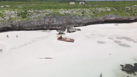 Drone-reveal-Mtende-beach-from-old-stranded-fishing-boat-on-Zanzibar-shore