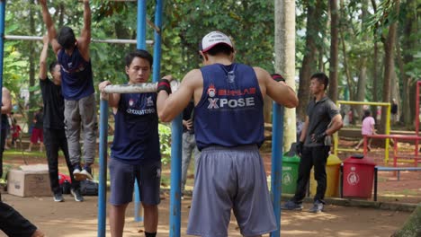 Asian-males,-fitness-routines,-calisthenics-workout,-outdoor-environment