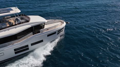 Big-luxury-yacht-making-waves-at-beautiful-blue-sea-in-slow-motion-filmed-by-drone