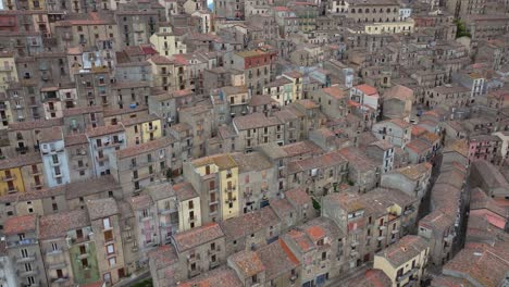 Forward-Drone-Shot-Above-Historic-Hilltop-Homes-in-Gangi,-Sicily,-Italy
