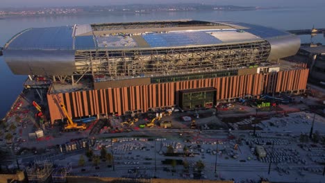 Orbiting-Everton-football-club-aerial-view-new-stadium-construction-on-Bramley-Moore-dock-Liverpool-waterfront