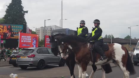 Two-female-mounted-police-officers-heading-to-Hampden-Park