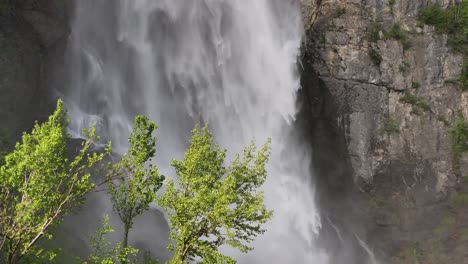 Water-cascades-onto-stones-and-rocks,-creating-a-picturesque-waterfall-scene-at-Seerenbachfälle-in-Amden-Betlis,-Walensee,-Switzerland