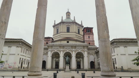 Historic-Basilica-and-statue-framed-by-ancient-columns-in-Milan
