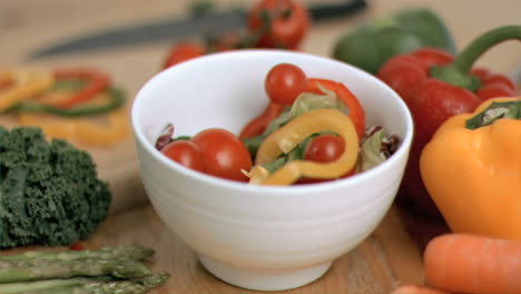 Tomatoes-dropping-in-super-slow-motion-into-salad