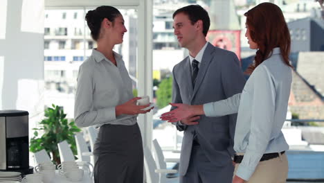 Woman-drinking-a-cup-of-coffee-before-shaking-hands