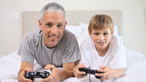 Happy-father-and-son-playing-video-games