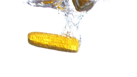 Corn-cobs-falling-into-water-in-super-slow-motion
