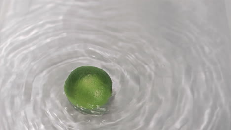 Lime-turning-in-water-in-super-slow-motion