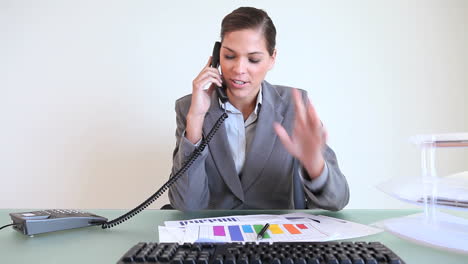 Businesswoman-calling-while-working