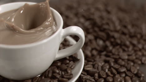 Sugar-cube-diving-in-super-slow-motion-in-a-white-coffee