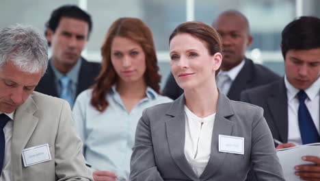 Business-people-listening-at-a-conference