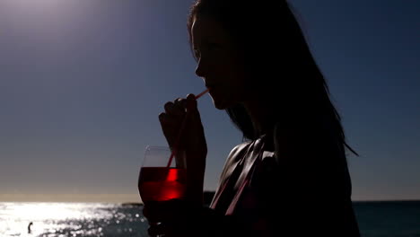 Woman-drinking-an-exotic-cocktail