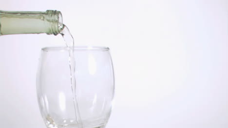 White-wine-flowing-in-super-slow-motion-from-a-bottle