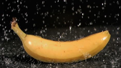 Water-raining-on-banana-in-super-slow-motion