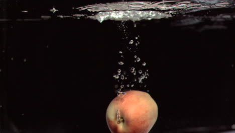 Apple-falling-into-water-in-super-slow-motion