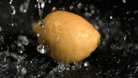 Water-raining-on-lemon-in-super-slow-motion