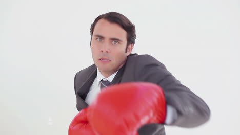 Serious-man-using-boxing-gloves