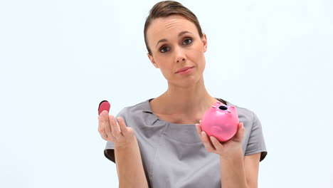 Businesswoman-holding-an-empty-piggybank-