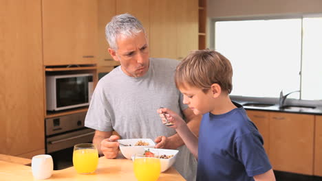 Father-and-son-eating-their-breakfast