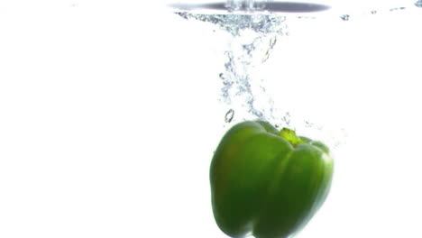 Pepper-dropped-into-water-in-super-slow-motion