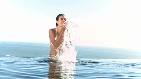 Woman-splashing-water-on-her-face-in-slow-motion