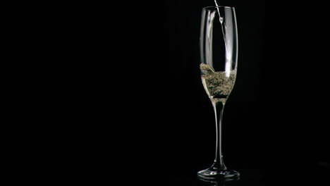 White-wine-poured-in-super-slow-motion-in-a-flute-glass