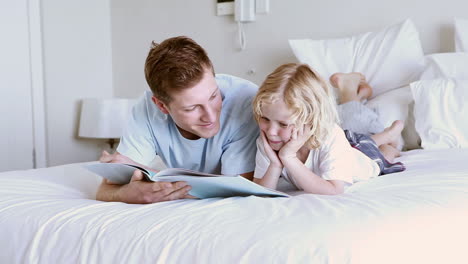 Child-reading-a-book-with-his-father