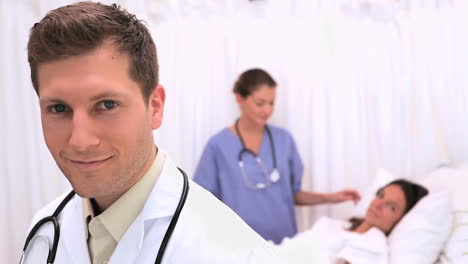 Doctor-standing-in-front-of-his-patient