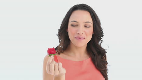 Girl-sexily-eats-a-part-of-a-strawberry