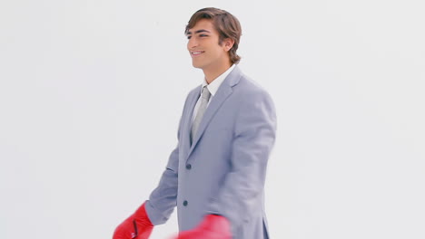 Happy-businessman-using-boxing-gloves