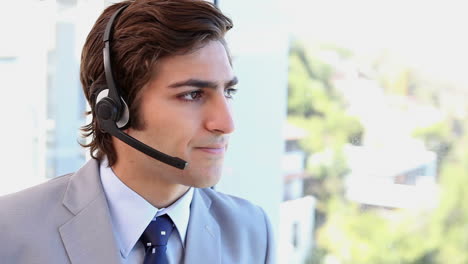 A-businessman-talking-with-a-headset