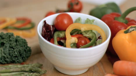 Tomatoes-dropping-into-salad-in-super-slow-motion